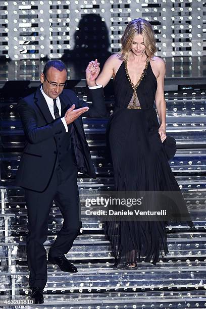 Carlo Conti and Charlize Theron attend second night 65th Festival di Sanremo 2015 at Teatro Ariston on February 11, 2015 in Sanremo, Italy.