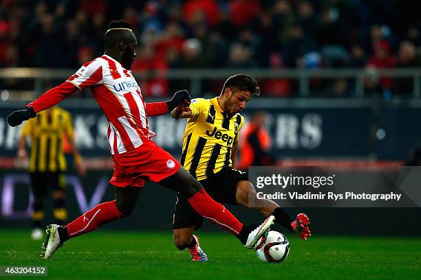 Vangelis Platellas of AEK attacks as Arthur Masuaku of Olympiacos defends during the Greek Cup match between Olympiacos Piraeus and AEK Athens at...