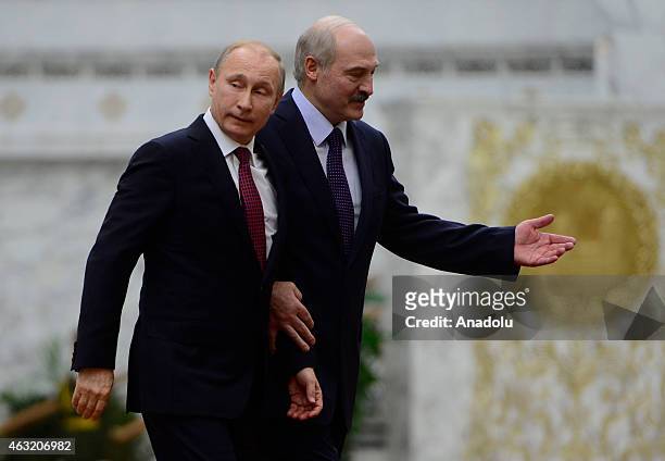 Russian President Vladimir Putin is welcomed by Belarus President Alexander Lukashenko ahead of the peace talks over the situation in Eastern Ukraine...