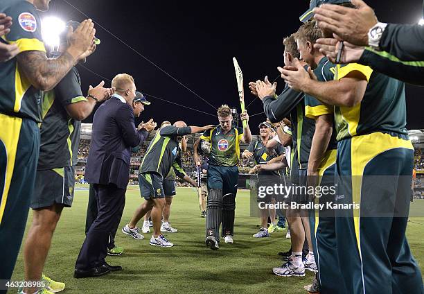 James Faulkner of Australia is cheered off by team mates after hitting the winning runs after the second game of the One Day International Series...