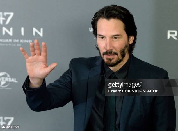 Canadian actor Keanu Reeves waves during a photo call for his new movie "47 Ronin" in Munich, southern Germany, on January 17, 2014. The movie be out...
