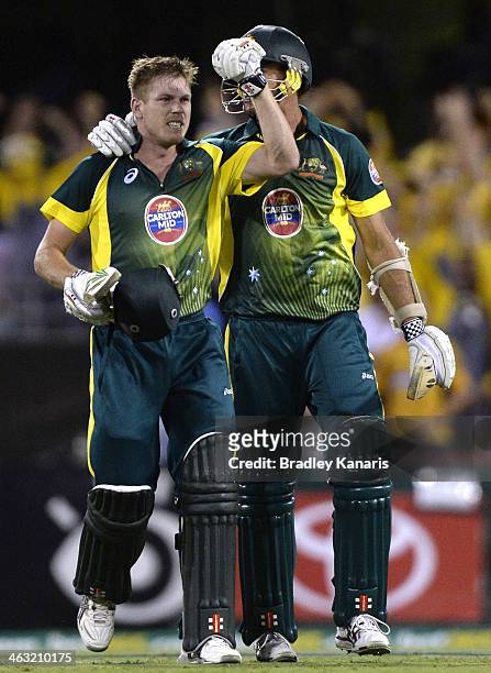James Faulkner and Clint McKay of Australia celebrate victory after the second game of the One Day International Series between Australia and England...
