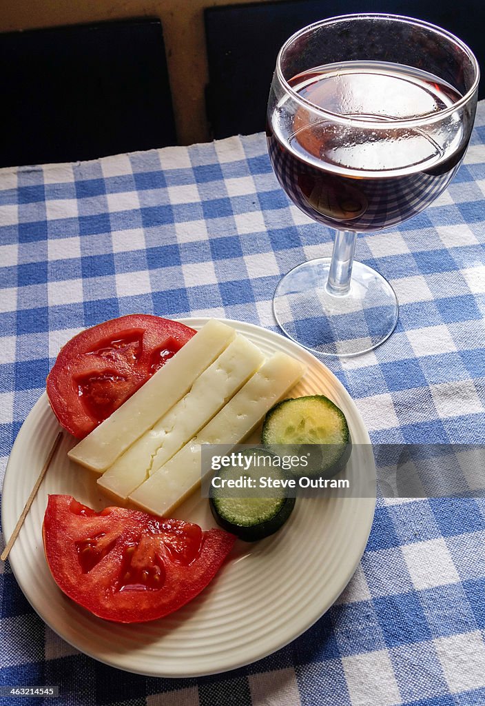 Graviera cheese meze and red wine