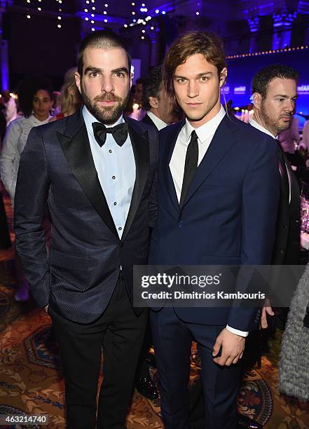 Zachary Quinto and Miles McMillan attend the 2015 amfAR New York Gala at Cipriani Wall Street on February 11, 2015 in New York City.