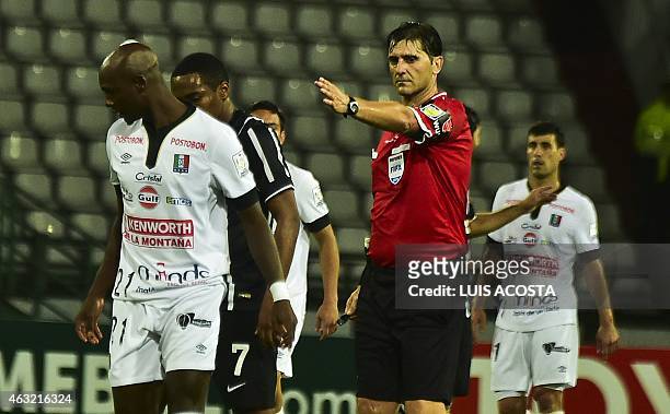 Uruguayan referee Dario Ubriaco makes a call during the 2015 Copa Libertadores football match between Colombia's Once Caldas and Brazils Corinthians...