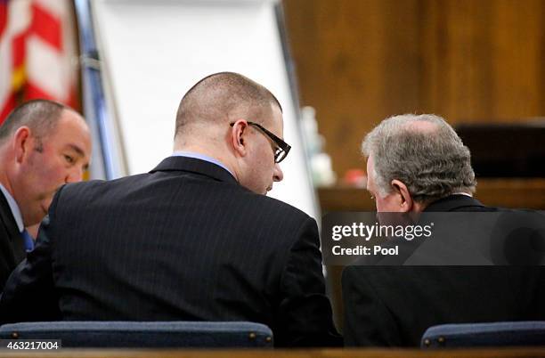 Former Marine Cpl. Eddie Ray Routh visits with his court appointed defense attorney Tim Moore during his capital murder trial at the Erath County...