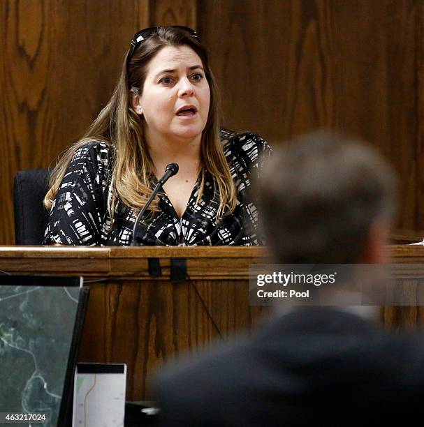 Midlothian dispatcher Raelee Parrish listens to questions from Assistant District Attorney Jane Starnes during the capital murder trial of former...