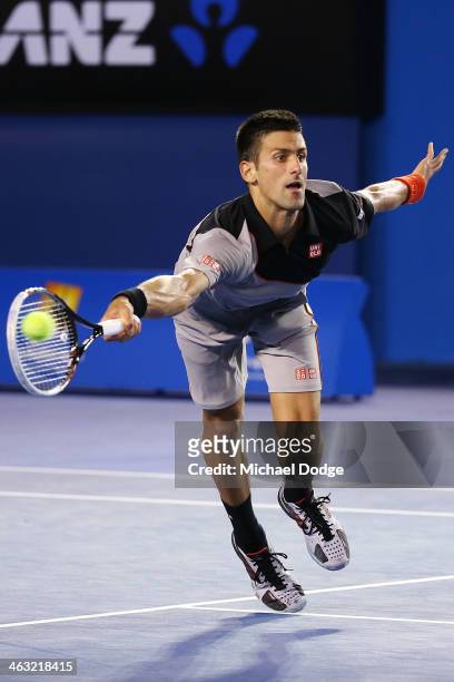 Novak Djokovic of Serbia hits a forehand volley in his third round match against Denis Istomin of Uzbekistan during day five of the 2014 Australian...