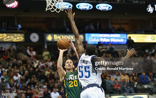 Gordon Hayward of the Utah Jazz takes a shot against Bernard James of the Dallas Mavericks at American Airlines Center on February 11, 2015 in...