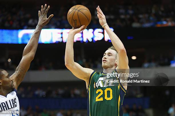 Gordon Hayward of the Utah Jazz takes a shot against Bernard James of the Dallas Mavericks at American Airlines Center on February 11, 2015 in...