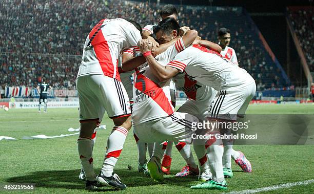Carlos Sanchez of River Plate celebrates with his teammates after scoring the first goal of his team during a second leg match between San Lorenzo...