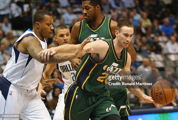 Gordon Hayward of the Utah Jazz dribbles the ball against Greg Smith of the Dallas Mavericks at American Airlines Center on February 11, 2015 in...
