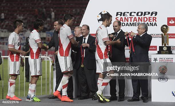 River Plate's footballers receive their medals from members of the Conmebol after defeating San Lorenzo 1-0 in the Recopa Sudamericana 2015 second...