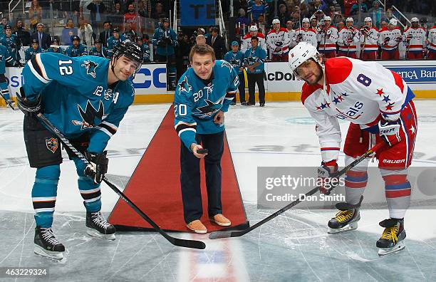 Patrick Marleau of the San Jose Sharks poses as Evgeni Nabokov drops the puck in honor of his retirement with the San Jose Sharks against Alex...