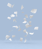 Lots of white blank papers flying with light blue background