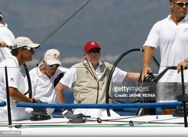 Spain's King Juan Carlos I sails on board of the ship Bribon on the second day of the Copa del Rey regatta in Palma de Mallorca on August 04, 2009....