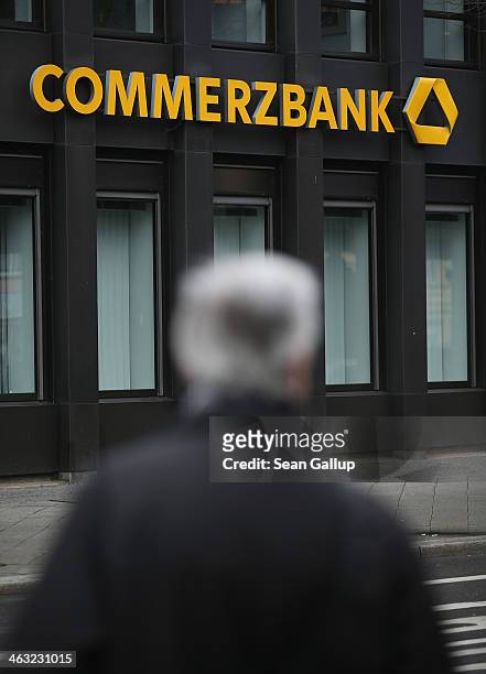 People walk past a branch of Commerzbank bank on January 17, 2014 in Berlin, Germany. Banks across Europe will be announcing their financial results...