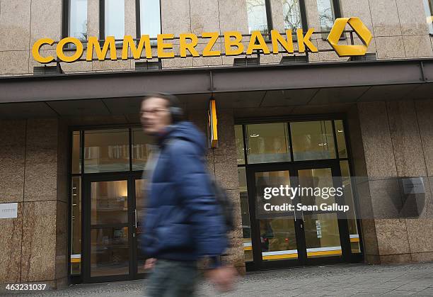 People walk past a branch of Commerzbank bank on January 17, 2014 in Berlin, Germany. Banks across Europe will be announcing their financial results...