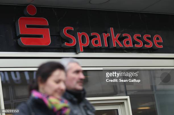 People walk past a branch of Berliner Sparkasse bank on January 17, 2014 in Berlin, Germany. Banks across Europe will be announcing their financial...