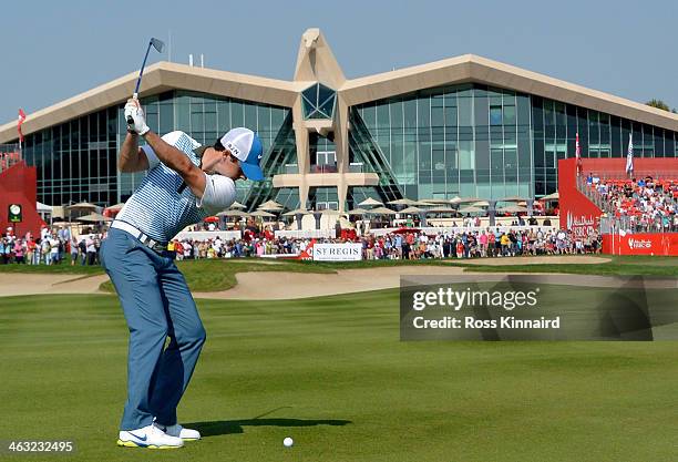 Rory McIlroy of Northern Ireland plays his second shot on the par four 9th hole during the second round of the Abu Dhabi HSBC Golf Championship at...