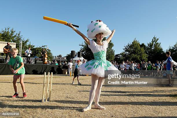 Young girl plays backyard cricket during the Opening Ceremony ahead of the ICC 2015 Cricket World Cup at Hagley Park on February 12, 2015 in...