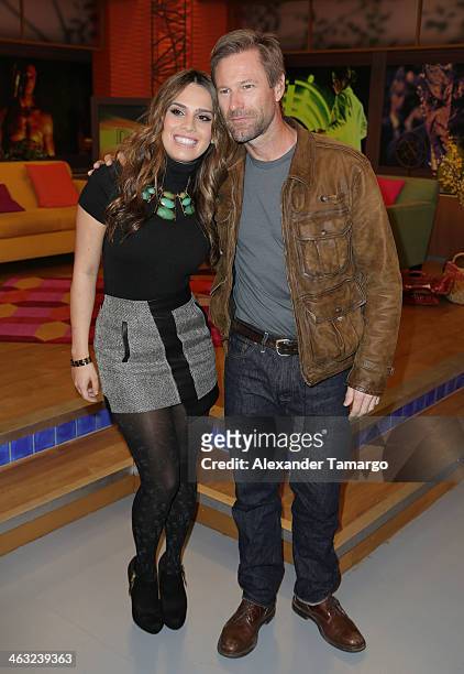 Andrea Chediak and Aaron Eckhart are seen on the set of Univision's "Despierta America" at Univision Headquarters on January 17, 2014 in Miami,...