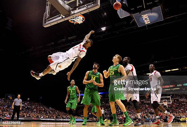 Russ Smith of the Louisville Cardinals falls to the court afterhe missed a dunk attempt in the second half against the Oregon Ducks during the...