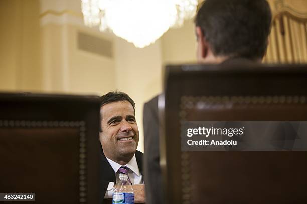 Representative John Ratcliffe speaks with another committee member before a House Committee of Homeland Security hearing on terrorist threats in the...
