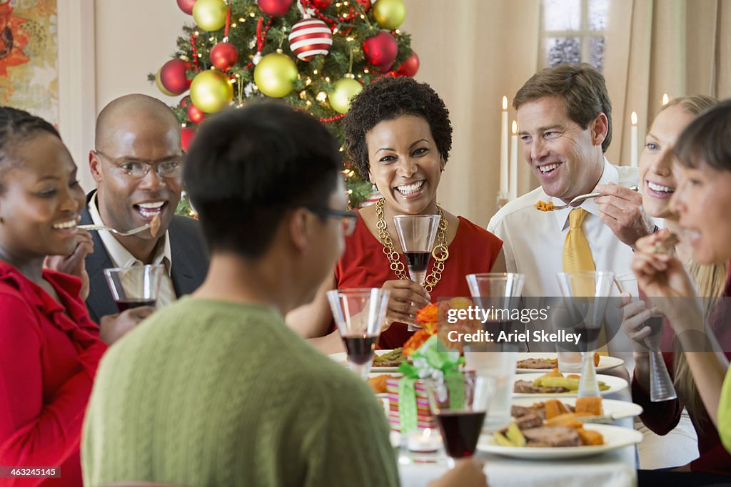 Friends enjoying Christmas dinner together