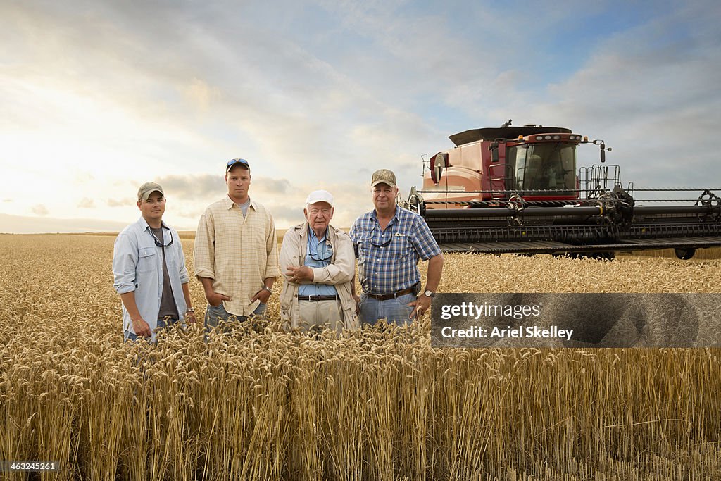 Three generations of Caucasian farmers in wheat field