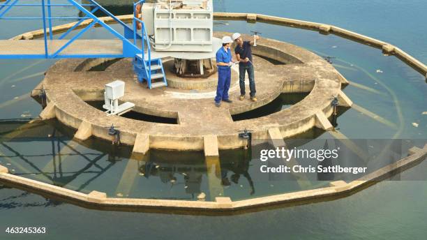 hispanic workers checking water quality - water treatment ストックフォトと画像