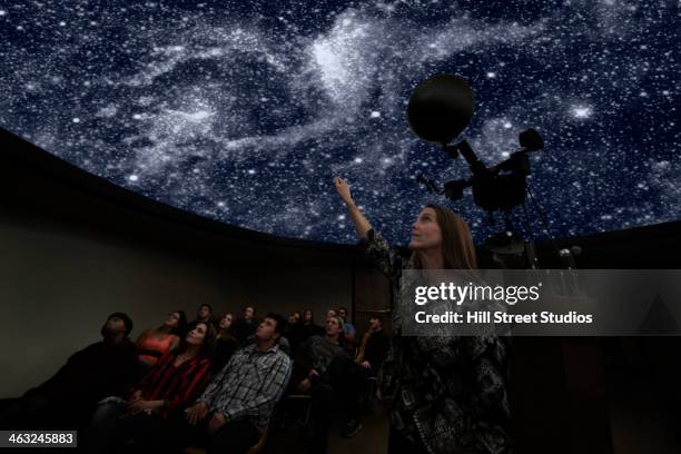 students watching galaxy in planetarium - observatory stock pictures, royalty-free photos & images