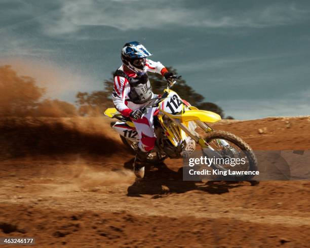 caucasian dirt bike rider on course - motocross photos et images de collection