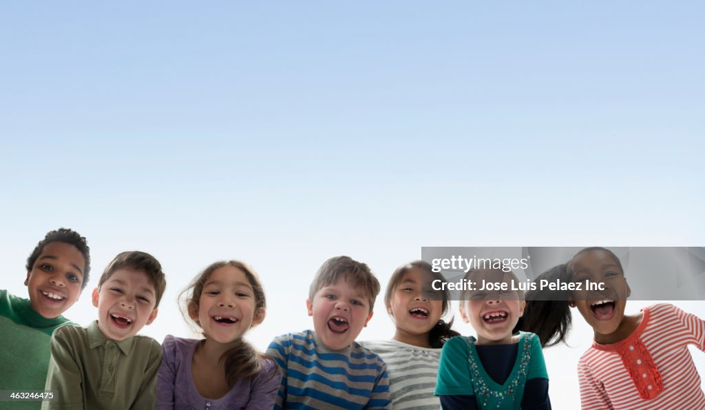 Children smiling together outdoors