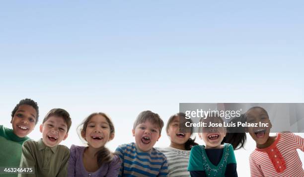 children smiling together outdoors - children only stock pictures, royalty-free photos & images