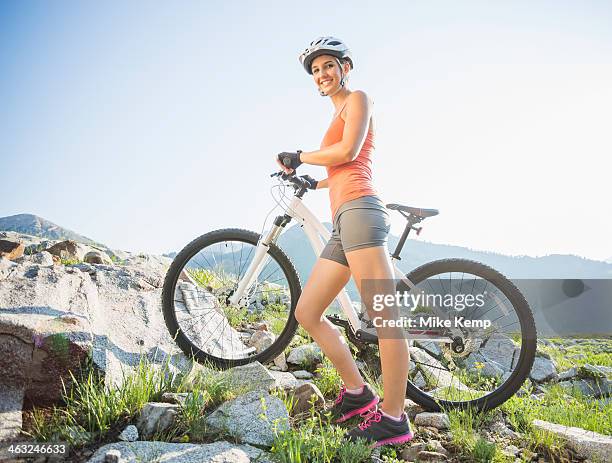 caucasian woman with mountain bike on rocky hillside - alta utah stock pictures, royalty-free photos & images