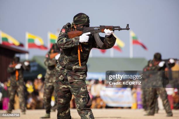 This picture taken on February 7, 2015 shows Shan State Army - South commandos demonstrating their combat skills during a military parade marking the...