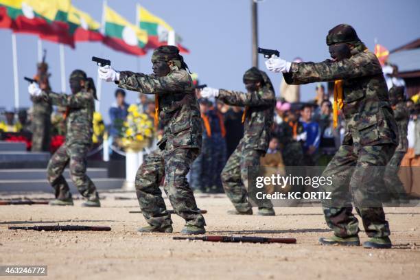 This picture taken on February 7, 2015 shows Shan State Army - South commandos taking aim during a military parade marking the Shan National Day at...