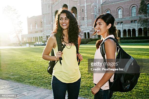 students talking on campus - three quarter length stock pictures, royalty-free photos & images