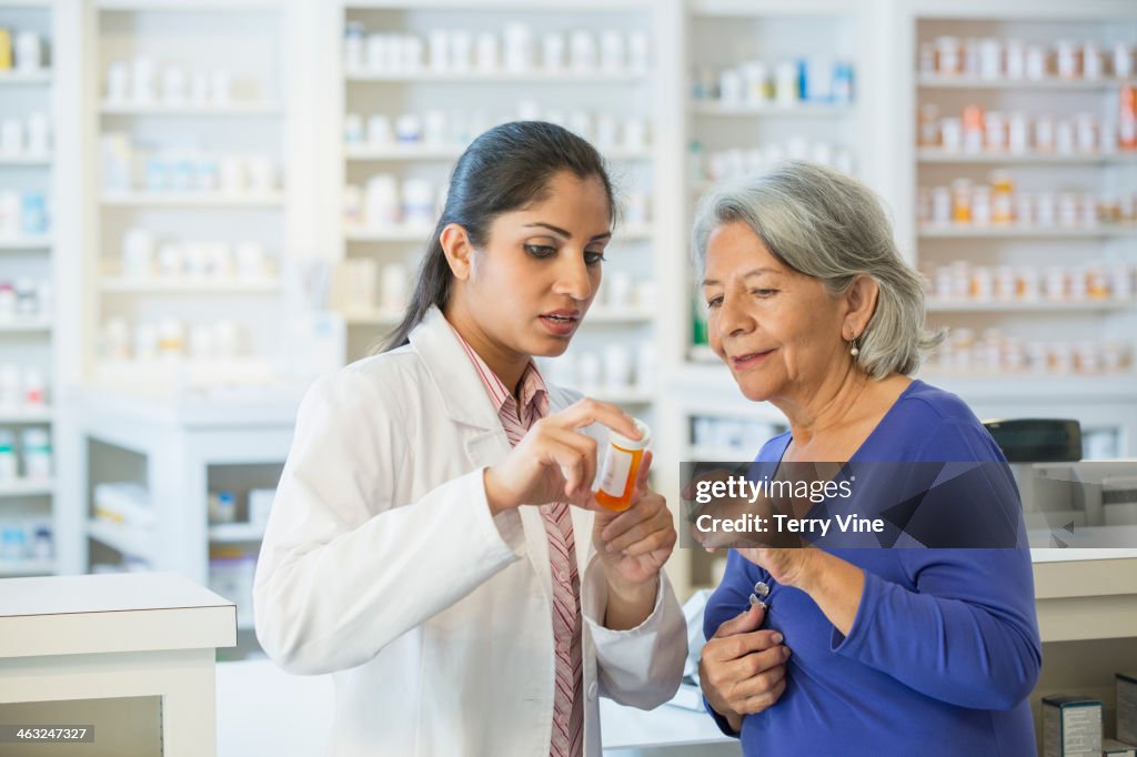 Pharmacist talking to customer