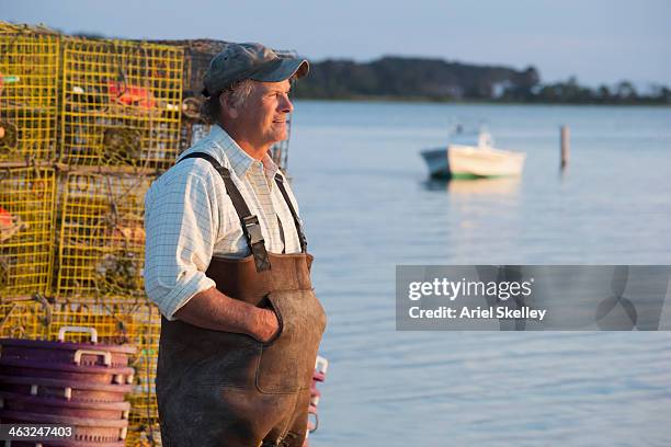 caucasian fisherman overlooking bay - chesapeake bay stockfoto's en -beelden