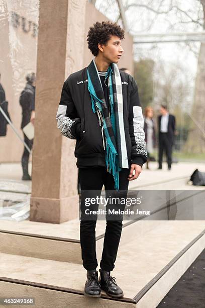 British model Jackson Hale wears a Cav Empt jacket and Burberry scarf at the London Collections: Men AW15 at on January 12, 2015 in London, England.