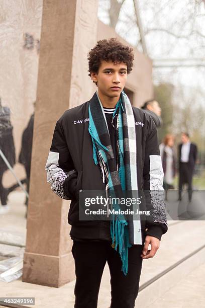 British model Jackson Hale wears a Cav Empt jacket and Burberry scarf at the London Collections: Men AW15 at on January 12, 2015 in London, England.