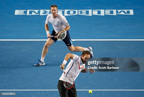 Paul Hanley of Australia and Jonathan Marray of Great Britain in action in their first round doubles match against Bob Bryan of the United States and...