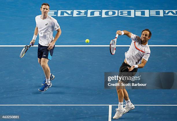 Paul Hanley of Australia and Jonathan Marray of Great Britain in action in their first round doubles match against Bob Bryan of the United States and...