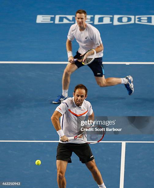 Paul Hanley of Australia and Jonathan Marray of Great Britain in action in their first round doubles match against Bob Bryan of the United States and...