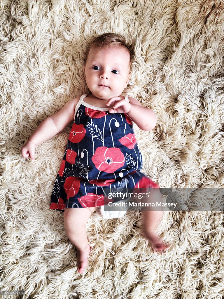 A baby playing on the floor