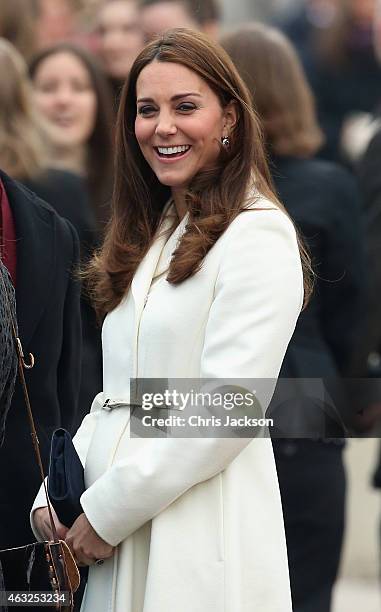 Catherine, Duchess of Cambridge laughs as she visits the home of Ben Ainslie Racing in Portsmouth Old Town on February 12, 2015 in Portsmouth,...