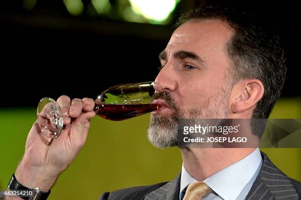 Spanish King Felipe drinks cava during his visit to Freixenet winery in the north-eastern Spanish Catalonian village of Sant Sadurni d'Anoia to...
