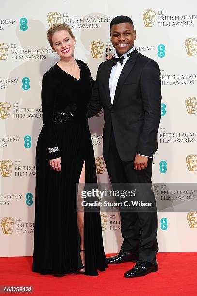 Alice Eve and John Boyega pose in the winners room at the EE British Academy Film Awards at The Royal Opera House on February 8, 2015 in London,...